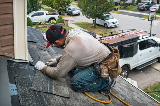 Professional Storm Damage Roof Repair technician working in Roslyn, SD